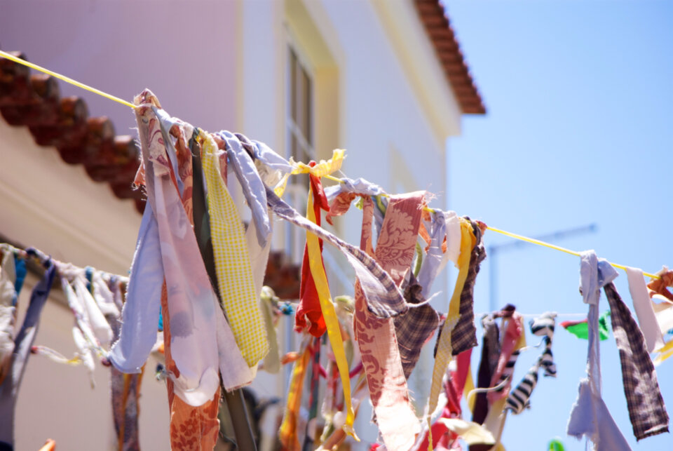 Clean laundry hanging on an outdoor clothesline on a sunny day